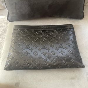 One year old good condition LV full leather clutch